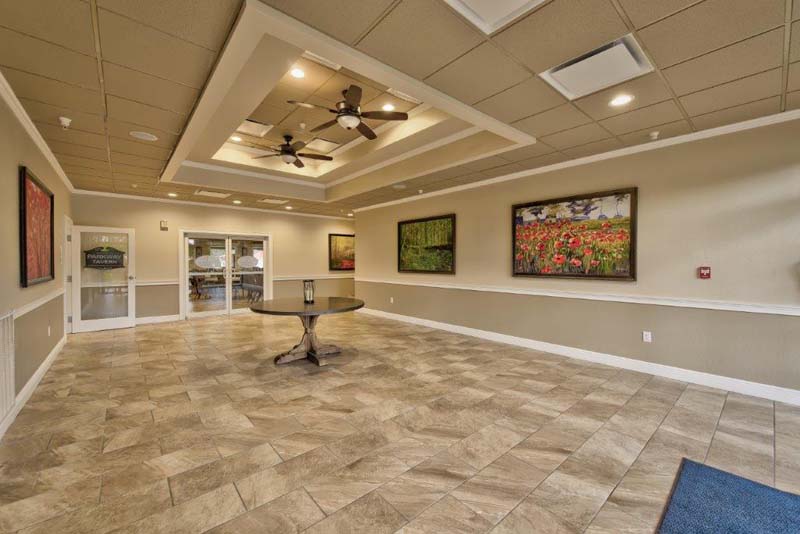 Foyer of clubhouse with art and shiny floors 